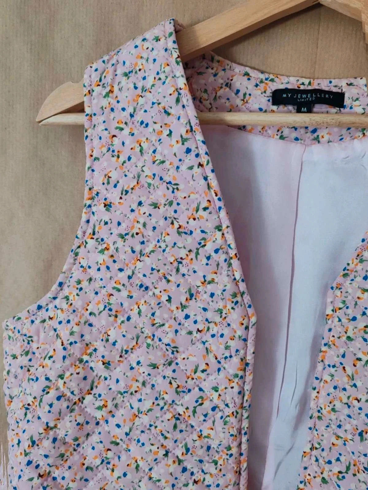 Gilet fleuri sans manches taille M