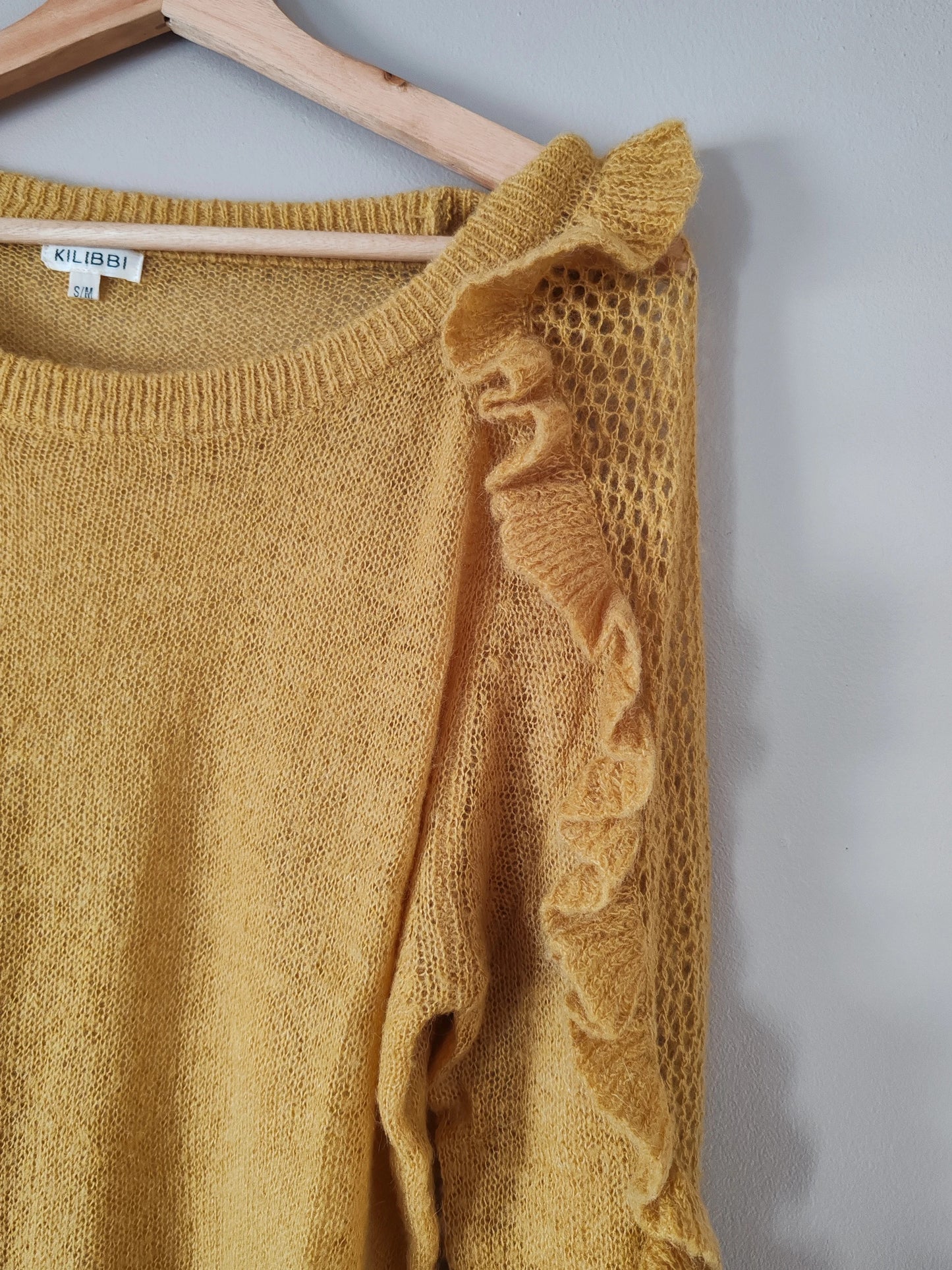 Pull moutarde volants taille S/M