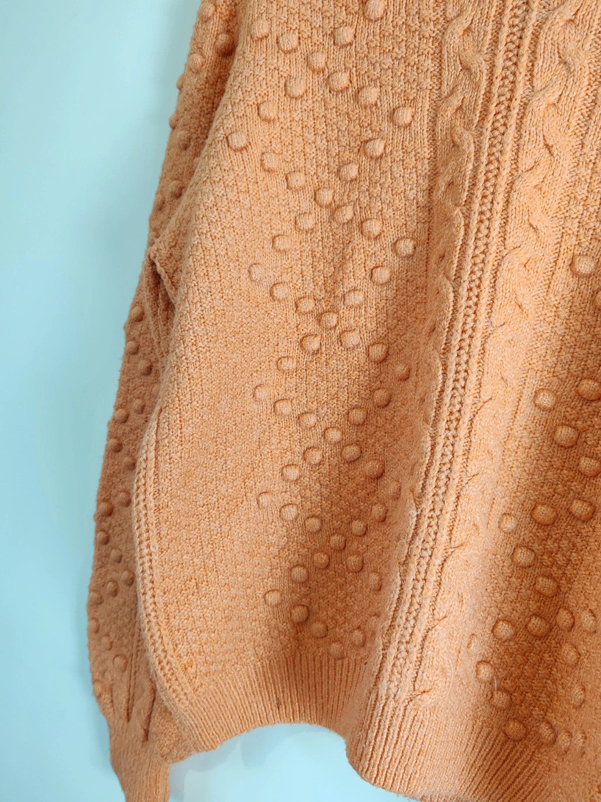 Pull pompons orange taille M